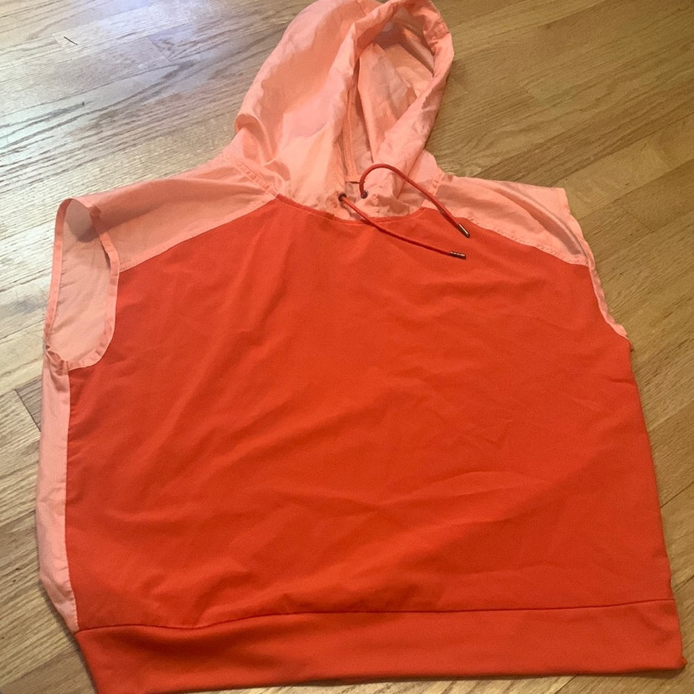 Thin windbreaker jacket. Pink/peach/red color. Size small. Never worn.